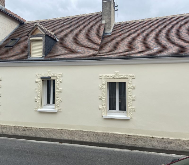 Renovated house with cream walls and tiled roof